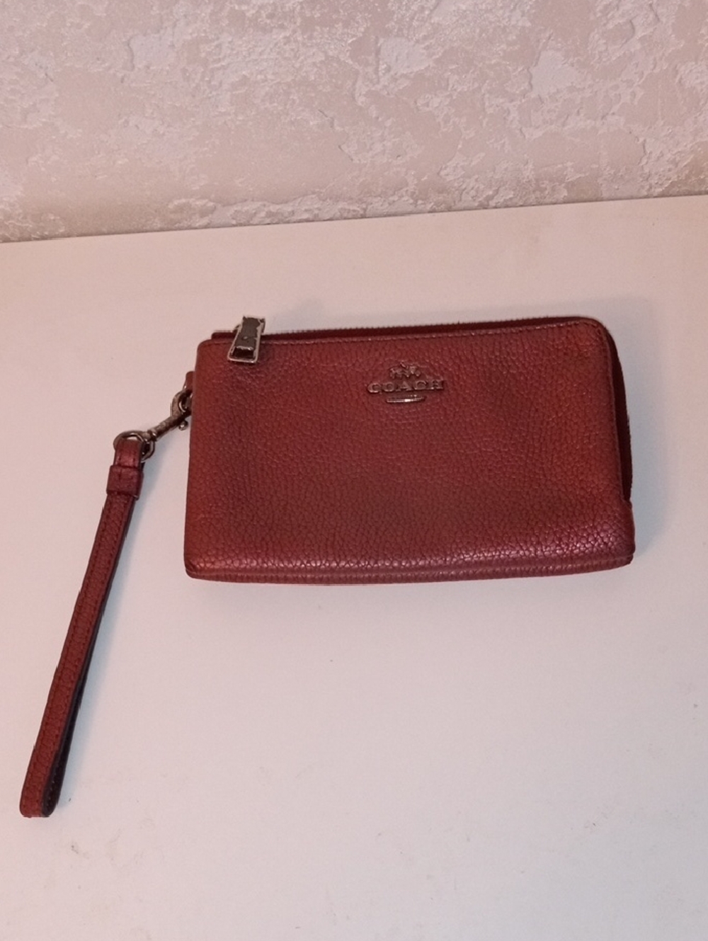 Coach Pebbled Leather Wristlet in Burnt Orange